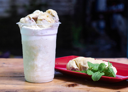 milkshake with durian pieces, in  plastic cup, delicious and fresh.の写真素材