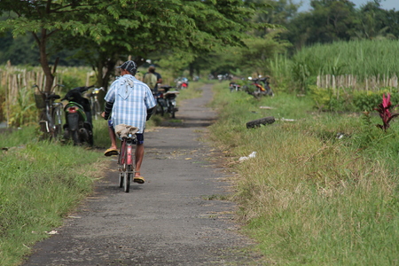 cycling around the villageの写真素材