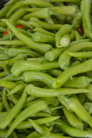 Many green chili peppers, Food raw materialの写真素材