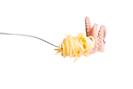 Fork with spaghetty and seafood isolated on white backgroundの写真素材