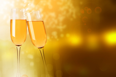 Two wine glasses with champagne on the blurred backgroundの写真素材