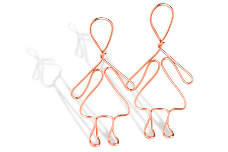 Women made from copper wire isolated on white backgroundの写真素材