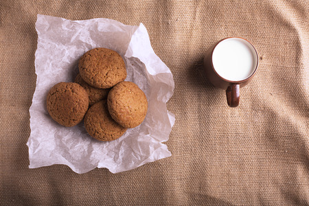 Oatmeal cookies and milk on the sackingの写真素材