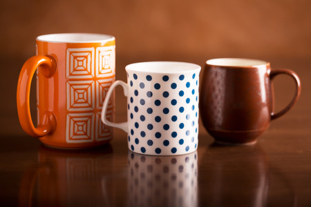Three tea cups with drink on the tableの写真素材