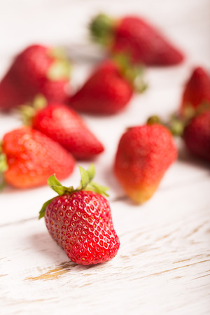 Strawberries on the wooden background (close up shot)の写真素材
