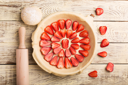 Strawberries pie on the wooden backgroundの写真素材
