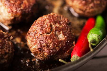 Fried meatballs on the pan (close up shot)の写真素材
