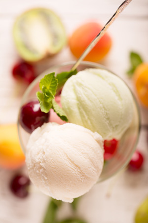 Tasty ice cream with fruits (close up)の写真素材