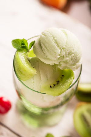 Tasty ice cream with kiwi and mintの写真素材
