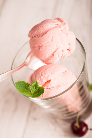 Tasty ice cream with cherryの写真素材
