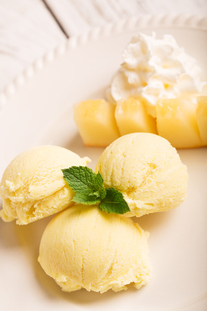 Tasty ice cream with mango and mintの写真素材