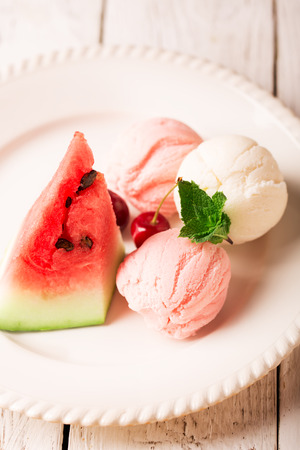 Tasty ice cream with watermelon and cherryの写真素材
