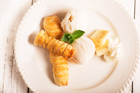 Tasty ice cream with crispy cake and bananaの写真素材