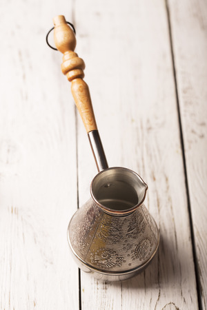 Coffee maker on a white wooden tableの写真素材