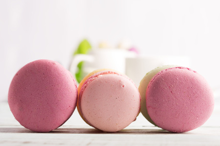 Macaroons on the wooden table (close up shot)の写真素材