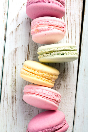 Macaroons on the wooden table (close up shot)の写真素材