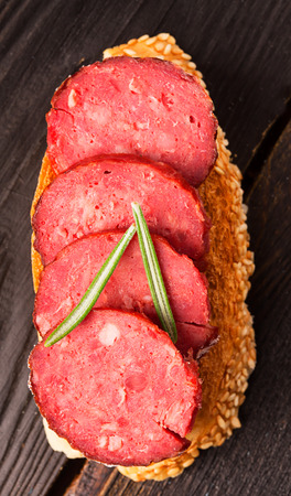 Toast with tasty chorizo and rosemaryの写真素材