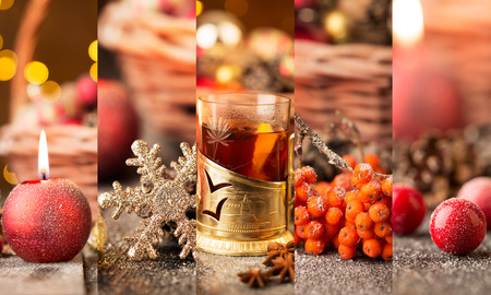 Christmas collage with red and golden ornaments, fir-cones and grog on a wooden tableの写真素材