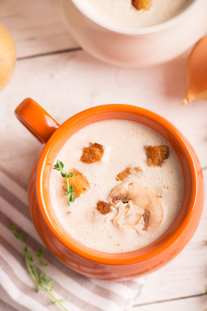 Delicious soup puree with mushrooms and croutonsの写真素材