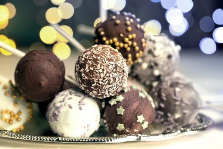 Colorful cake pops on the blurred bokeh backgroundの写真素材