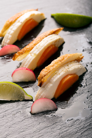 Sandwiches with cheese, boiled carrots and radishesの写真素材