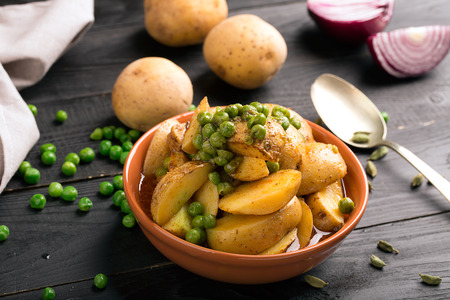 Vegetarian dish with stewed potatoes and peas (Aloo Mattar)の写真素材