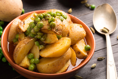 Vegetarian dish with stewed potatoes and peas (Aloo Mattar)の写真素材