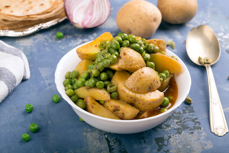 Vegetarian dish with stewed potatoes and peas (Aloo Mattar)の写真素材