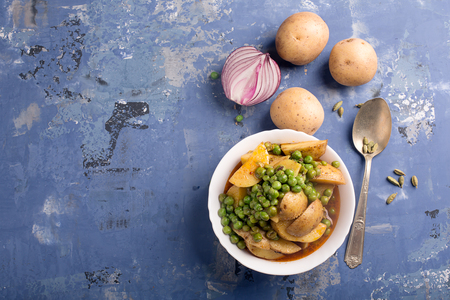 Vegetarian dish with stewed potatoes and peas (Aloo Mattar)の写真素材
