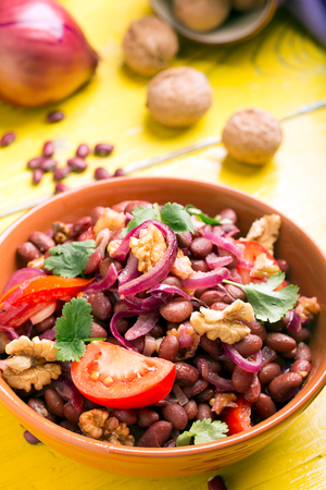 Red beans fried with onions, tomatoes and walnutsの写真素材