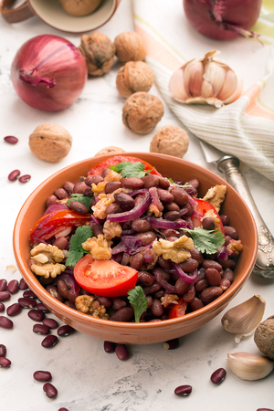 Red beans fried with onions, tomatoes and walnutsの写真素材
