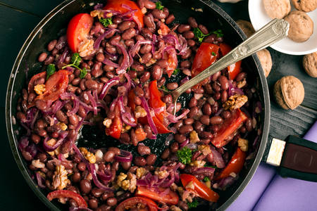 Red beans fried with onions, tomatoes and walnutsの写真素材