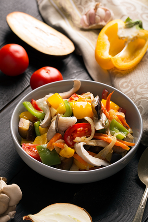 Vegetables stir fry with oyster mushrooms and sauceの写真素材
