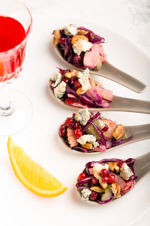 Vegetable salad of cabbage with walnuts and cheeseの写真素材