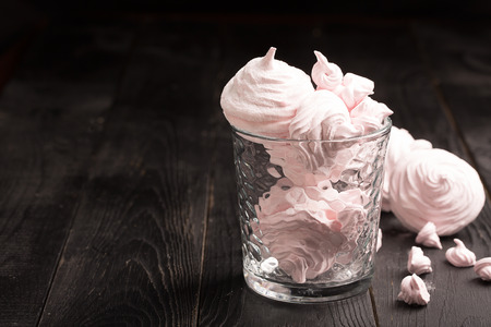 Delicious merengue on the dark table. Black backgroundの写真素材