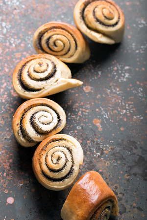 Delicious twisted baked buns with poppy seedsの写真素材