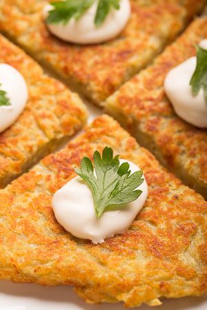 Traditional Irish potato pancakes Boxty with sour creamの写真素材