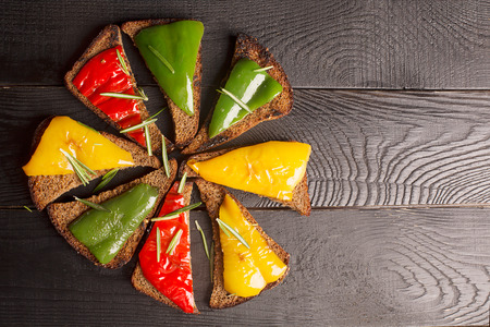 Tasty sandwiches with grilled bell pepper on a black backgroundの写真素材