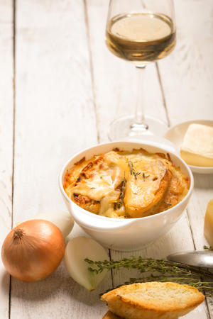 French onion soup with its ingredients (rustic style) with copy spaceの写真素材