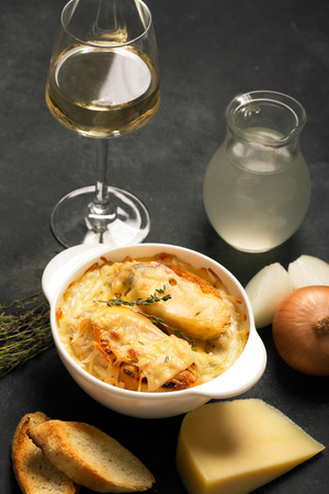 Traditional french onion soup prepared with croutons and cheeseの写真素材