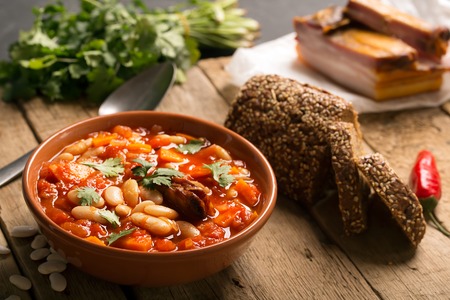 Rustic Kidney Bean Soup with beans and carrot. On the wooden tableの写真素材