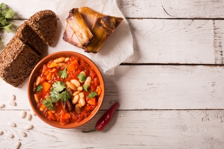 Rustic Kidney Bean Soup with beans and carrot. On the white wooden tableの写真素材