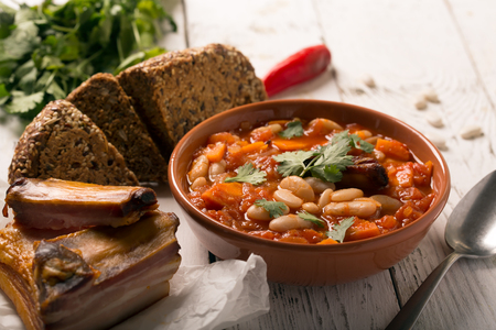 Rustic Kidney Bean Soup with beans and carrot. On the white wooden tableの写真素材