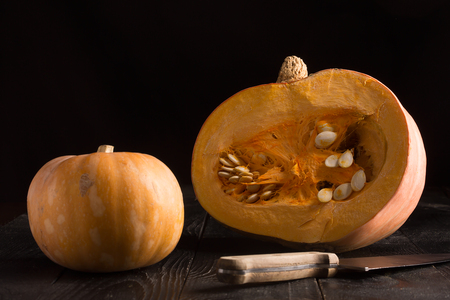 Pumpkins on the black wooden background. Horizontal orientationの写真素材