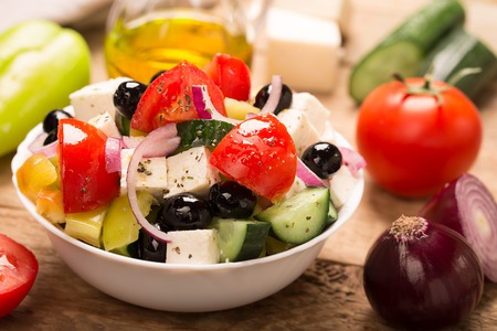 Greek salad ingredients: fresh vegetables, feta cheese and black olivesの写真素材