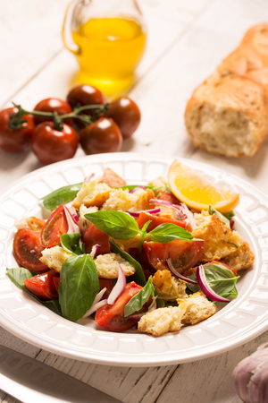 Italian Appetizer salad with tomatoes, bread,bazil mixed with lemon juiceの写真素材