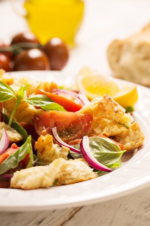 Italian Appetizer salad with tomatoes, bread,bazil mixed with lemon juice.Close upの写真素材