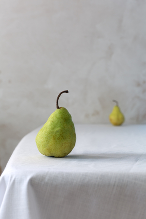 One green pear fruit on white background with clipping pathの写真素材