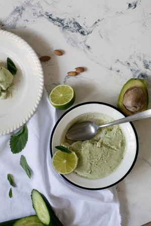 Hand made tasty ice cream prepared with avocado, cucumber and limeの写真素材