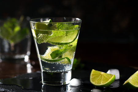 Mojito cocktail with lime and mint. Low key photoの写真素材